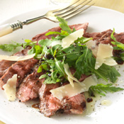Tagliata of Flank Steak with Arugula and Shaved Parmesan
